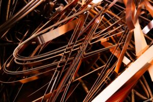 Abstract depiction of shiny metal scraps, emphasizing recycling in an industrial theme.